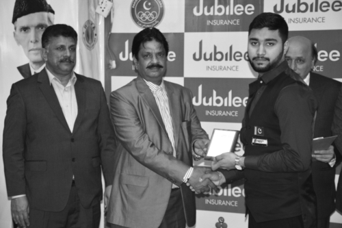 ISLAMABAD: Senior Vice President, Punjab Snookers Association, M B Ghauri, handing a shield to Haris Tahir of NBP who won the Jubilee Insurance U-21 National Snooker Championship at Islamabad, recently.