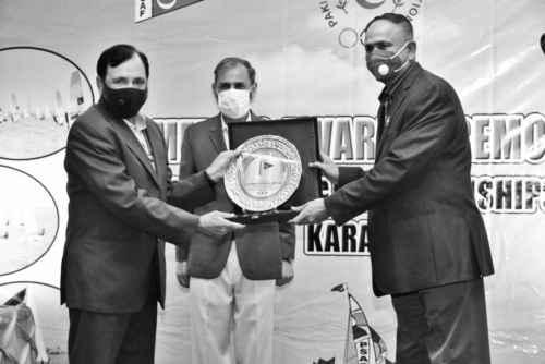 KARACHI: Vice Admiral Faisal Rasool Lodhi being presented with the memento at the award ceremony of National Sailing Championship 2020, recently.  