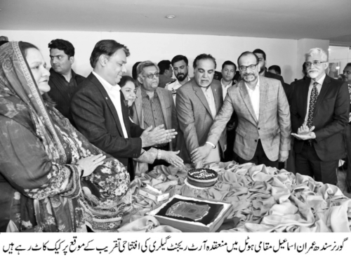 KARACHI: Sindh Governor Imran Ismail, along with dignitaries, cutting the cake at the inauguration of an art gallery at a hotel.